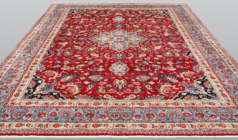 An old Meshed carpet, c. 342 x 252 cm.