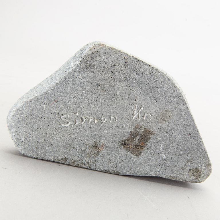 A simon Kristofferson signed stone figurine.