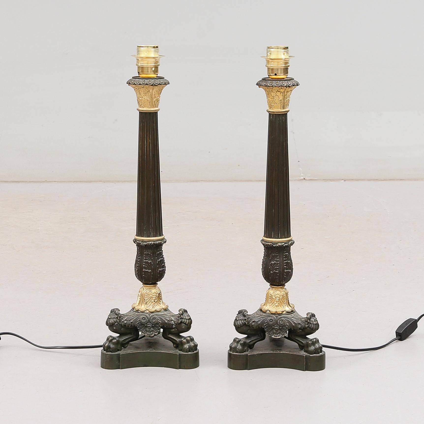 LAMPFÖTTER, 1 par, förgylld och patinerad brons, senempire, 1800-tal.