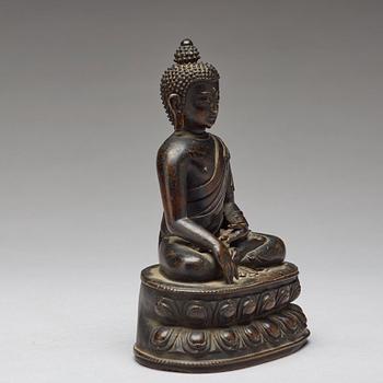 A copper alloy figure of Buddha Shakyamundi, Tibet, 17th Century.