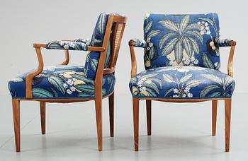 A pair of Josef Frank mahogany and ratten armchairs, Svenskt Tenn,
