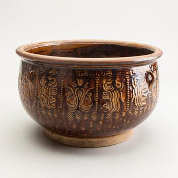 A large brown glazed jar, South East Asia, presumably 19th Century.