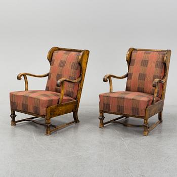 A pair of 1920s easy chairs.