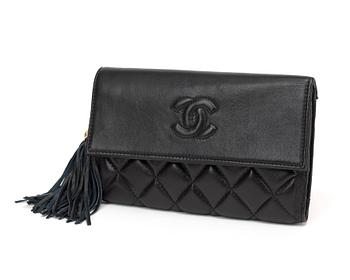 A black quilt leather wallet/evening bag by Chanel.