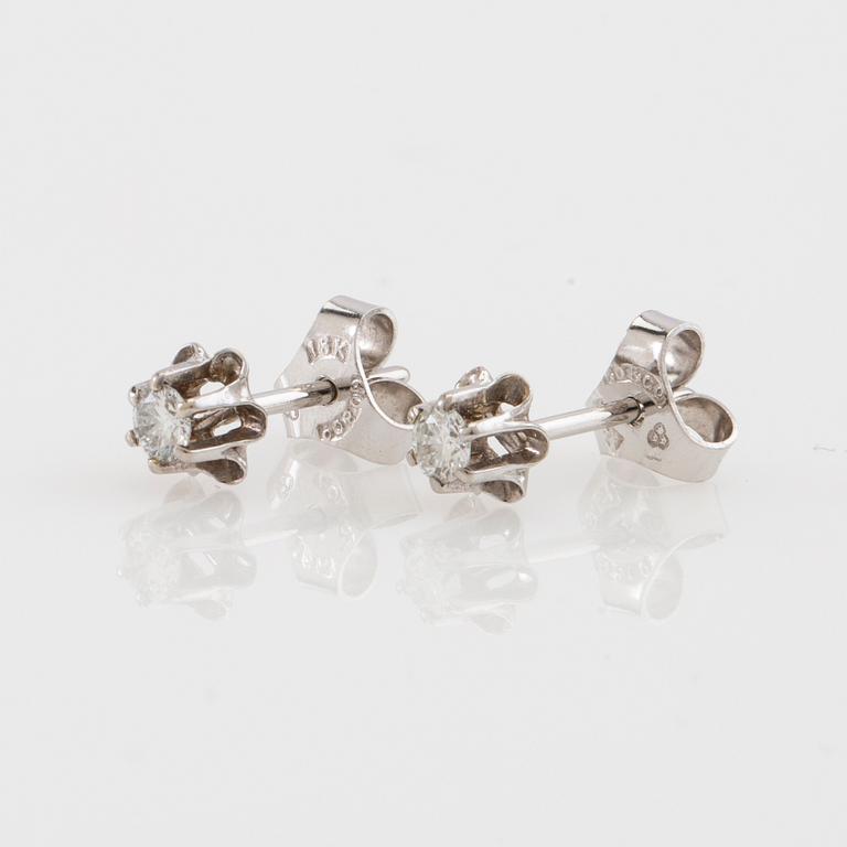 Earrings, a pair of 18K white gold set with round brilliant-cut diamonds.