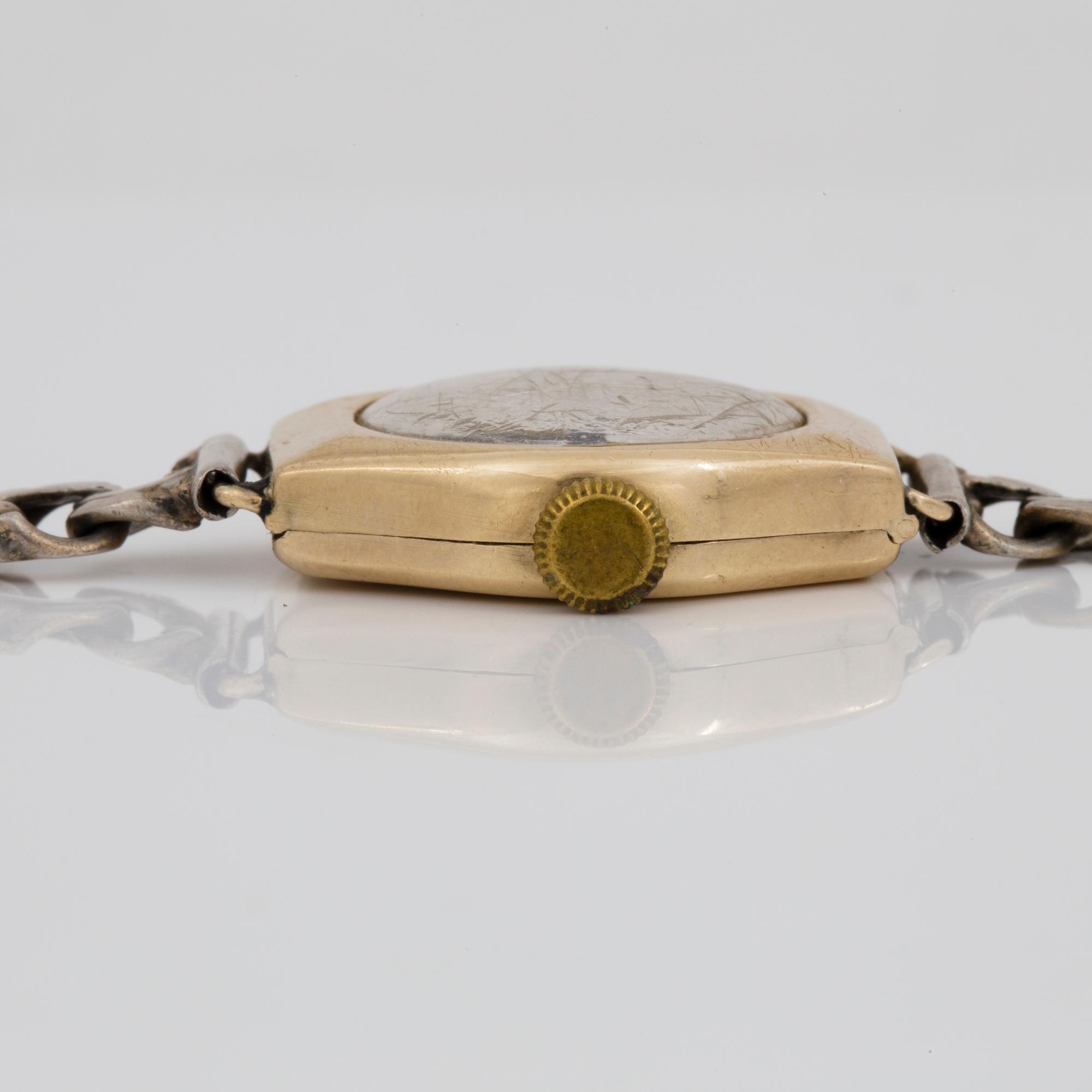 ARMBANDSUR, dam, 2 st, 1900-talets mitt, förgyllt silver och silver.