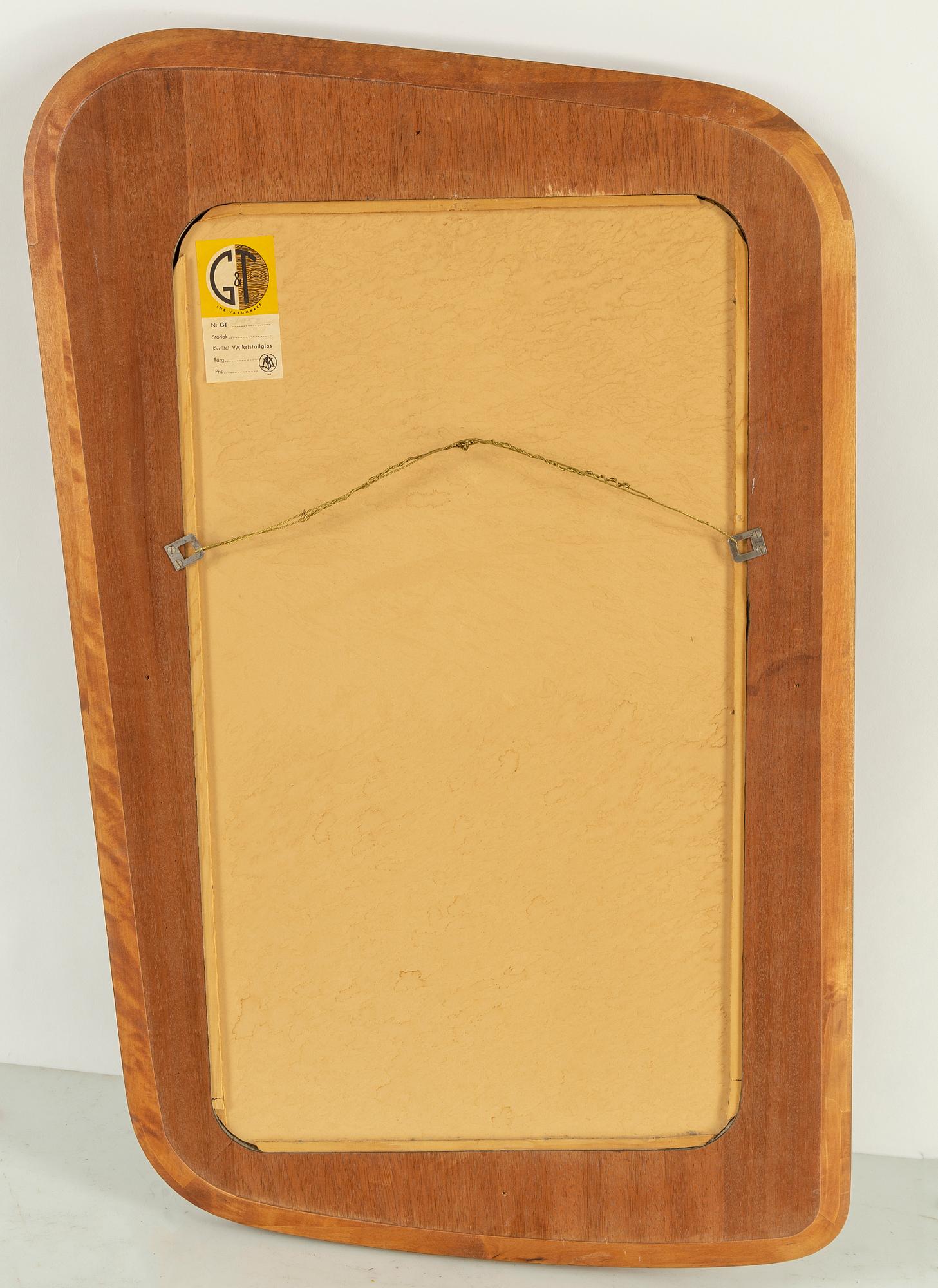 A swedish 1950s-60s mirror, Glas & Trä, Hovmantorp. Signed with label.