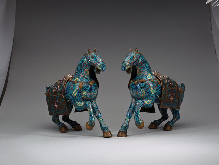 A pair of Chinese cloisonné figures of horses, presumably early 20th Century.