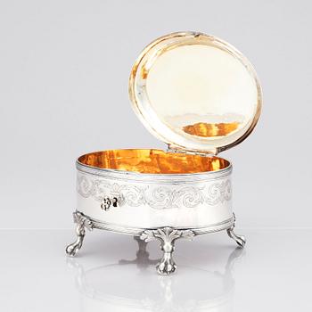 A silver suger bowl, marks of Johan Fredrik Wildt, Stockholm 1798, and a silver suger tong, Nils Arf, Stockholm 1799.