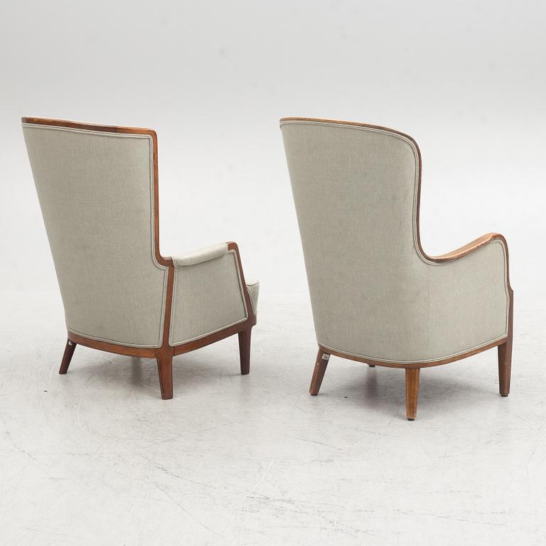 A pair of similar Swedish Modern armchairs, mid 20th century.