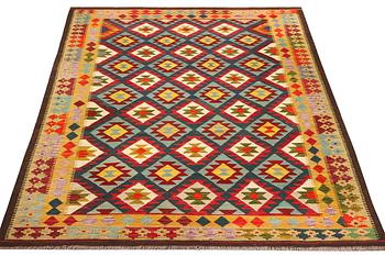 An Afghan Kelim carpet, c. 304 x 200 cm.