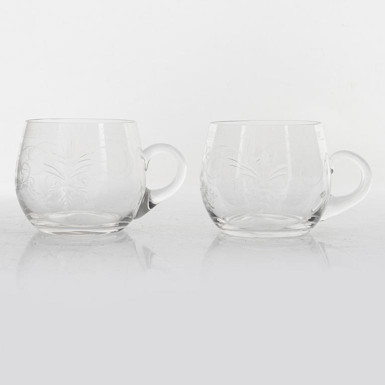 A punch bowl and mugs, glass, mid 20th century.