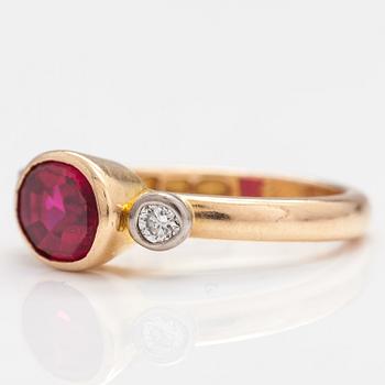 An 18K gold ring with a synthetic ruby and diamonds ca  0.22 ct in total. Lappi & K:ni, Lappeenranta 1925.