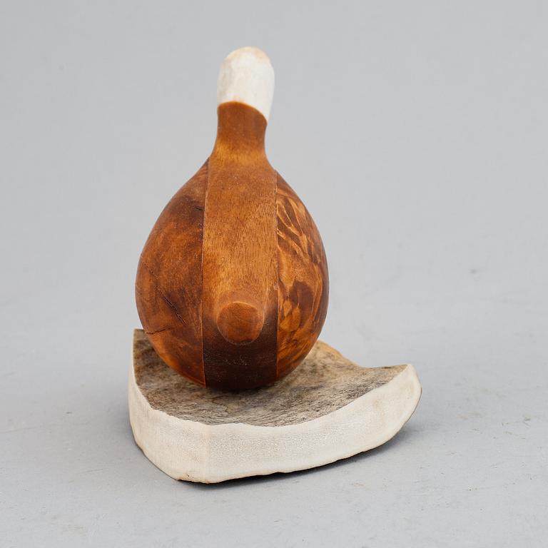 Lars Levi Sunna, a Sami reindeer horn and birch figurine of a grouse, signed LL Sunna.