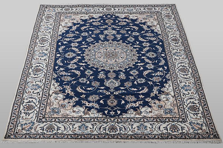 A carpet, Nain, part silk, ca 294 x 198 cm.