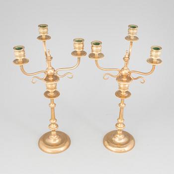 A pair of Candelabra, in brass Westerås Metallfabriks AB, late 19th century.