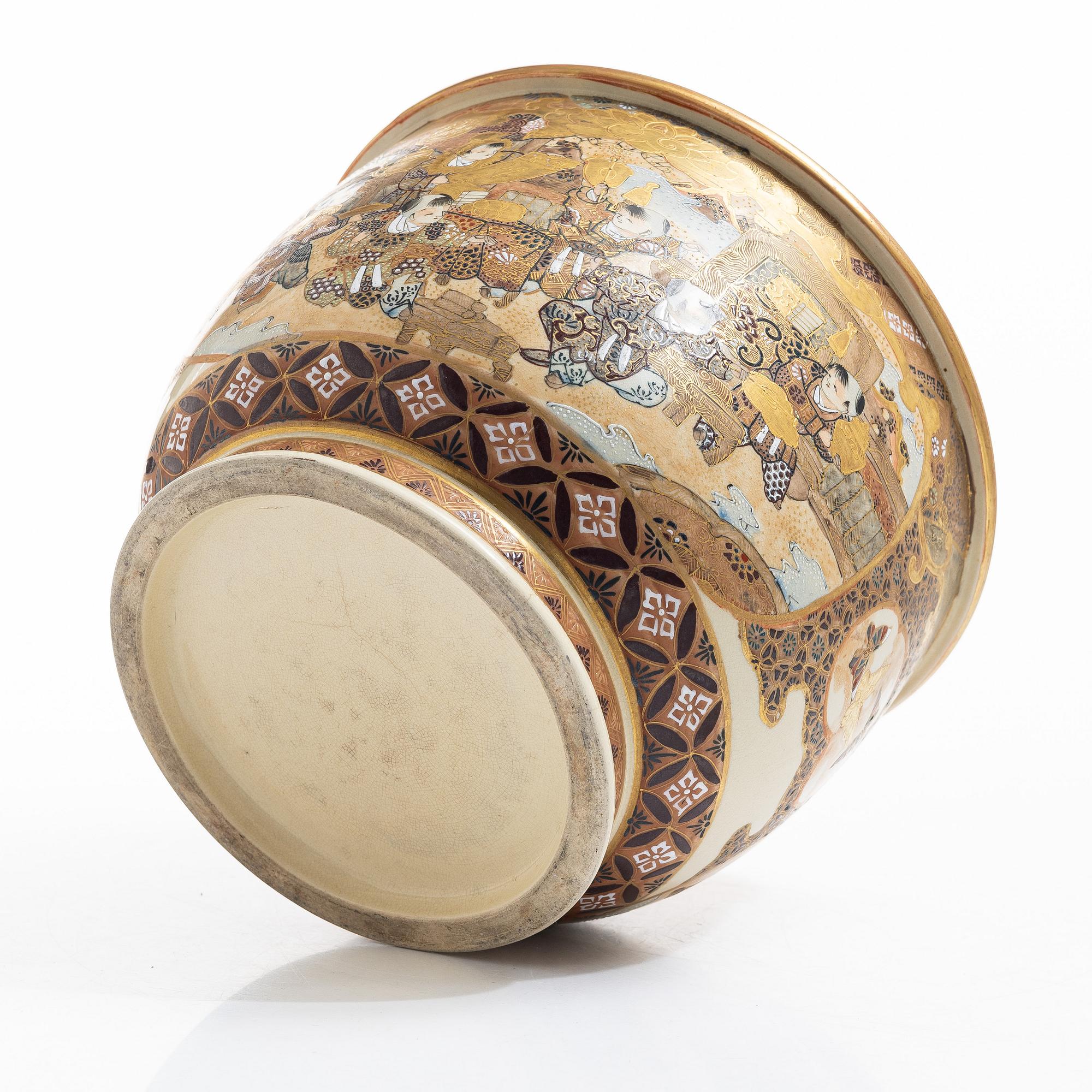 A Japanese satsuma figural flower pot, early 20th century.