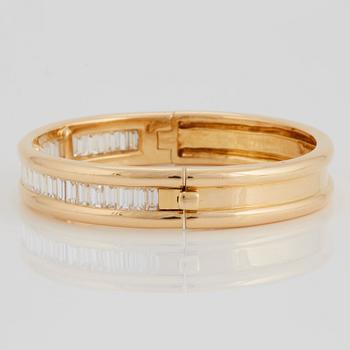 An 18K gold bracelet set with baguette-cut diamonds 7.715 cts according to engraving.