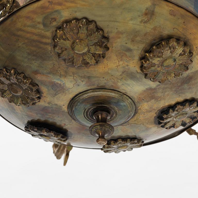 An empire style brass chandelier, around 1900.