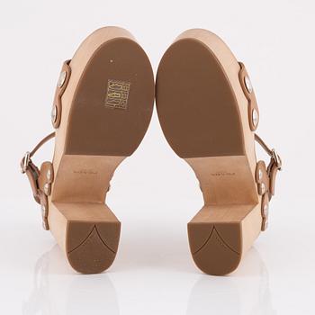 Prada, a pair of wood and leather sandals, size 37.