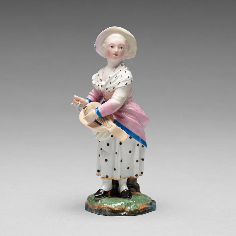 A porcelainfigure of a female musician, "Höchst mark", circa 1900.