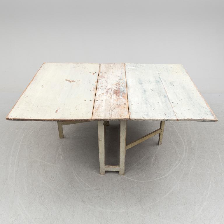 a gate-legged table from the first half of the 19th century.