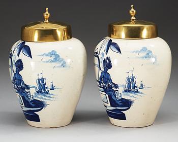 A pair of Dutch fainece tobacco jars, 18th Century.