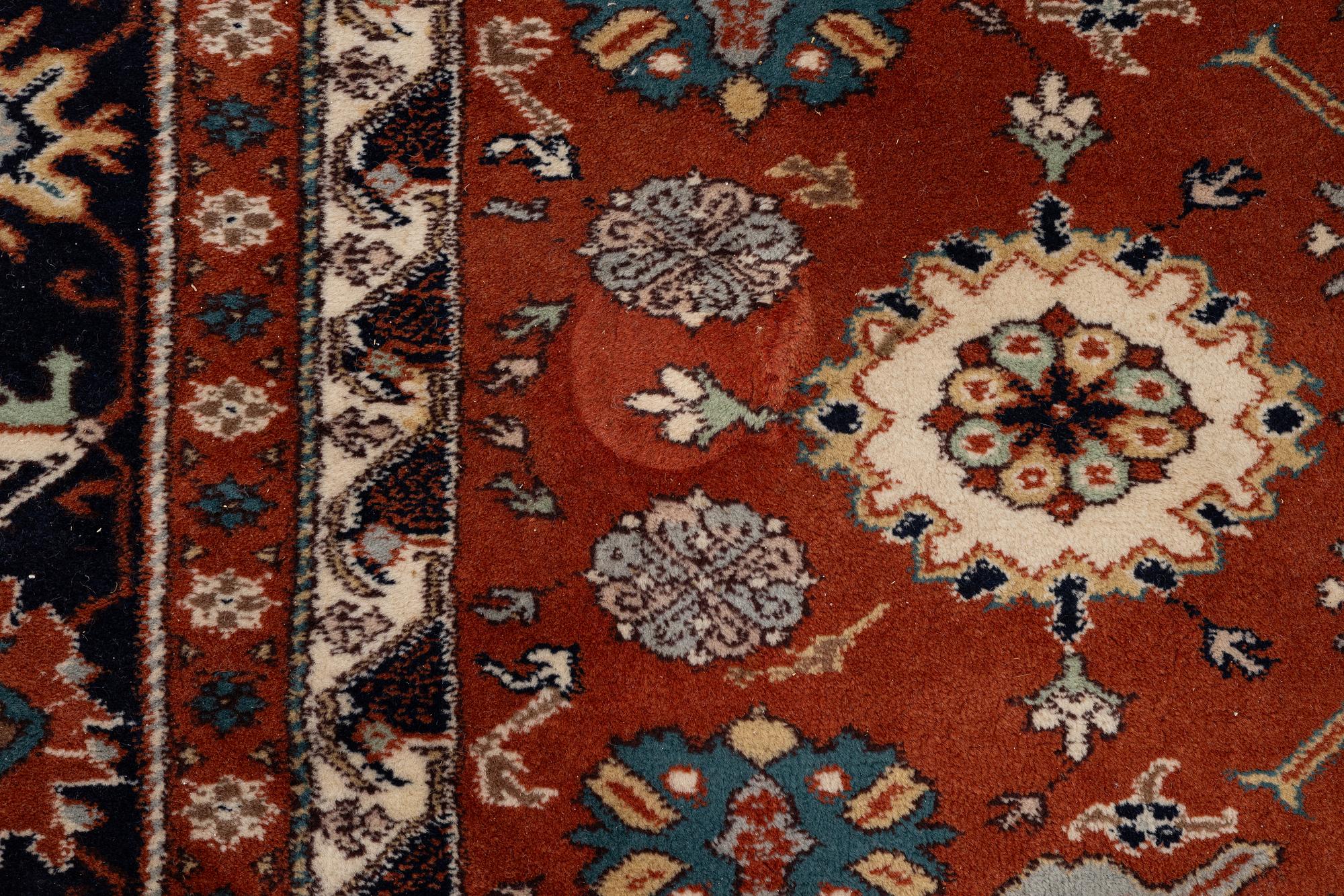 A semi-antique Orientall carpet c. 318 x 202 cm.
