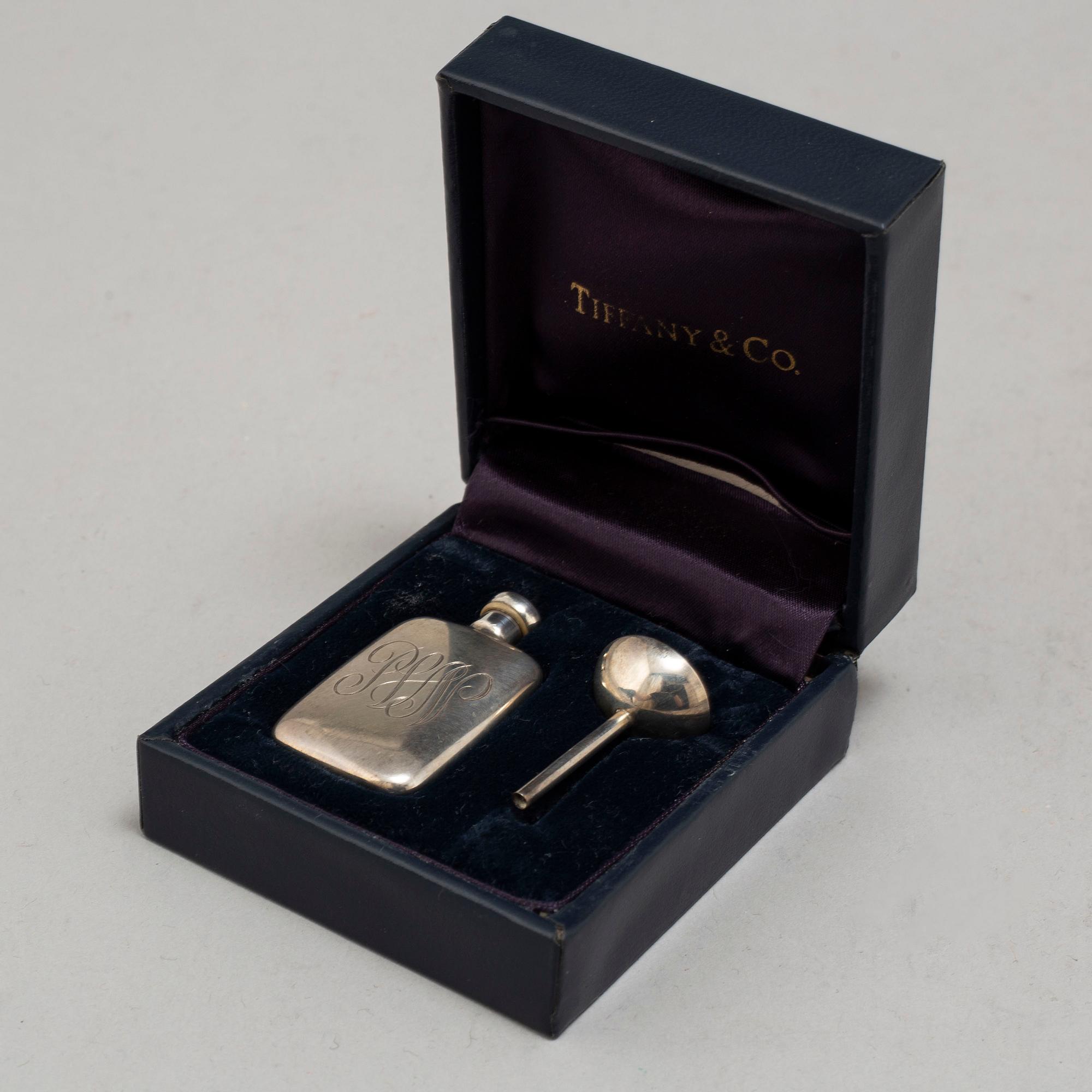 A TIFFANY & CO PERFUME BOTTLE, silver.