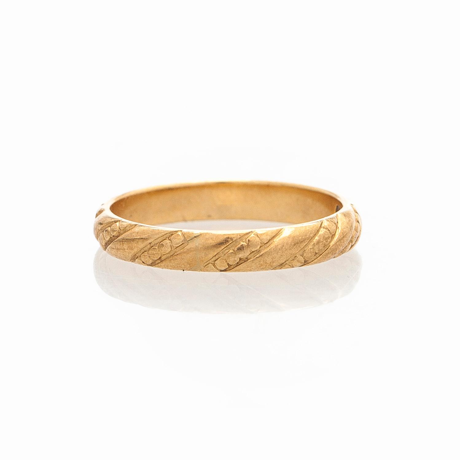 Kalevala Koru, ring "Halikon Lampolan kierresormus", 18K guld, Helsingfors 1998.