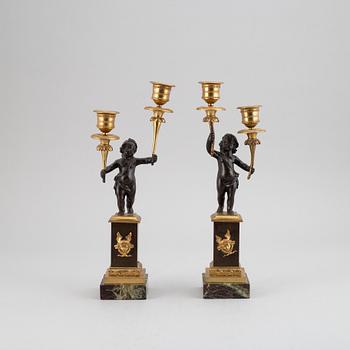 A pair of bronze empire style candleabra, 20th century.