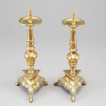 A  pair of 17th century bronze candlesticks.