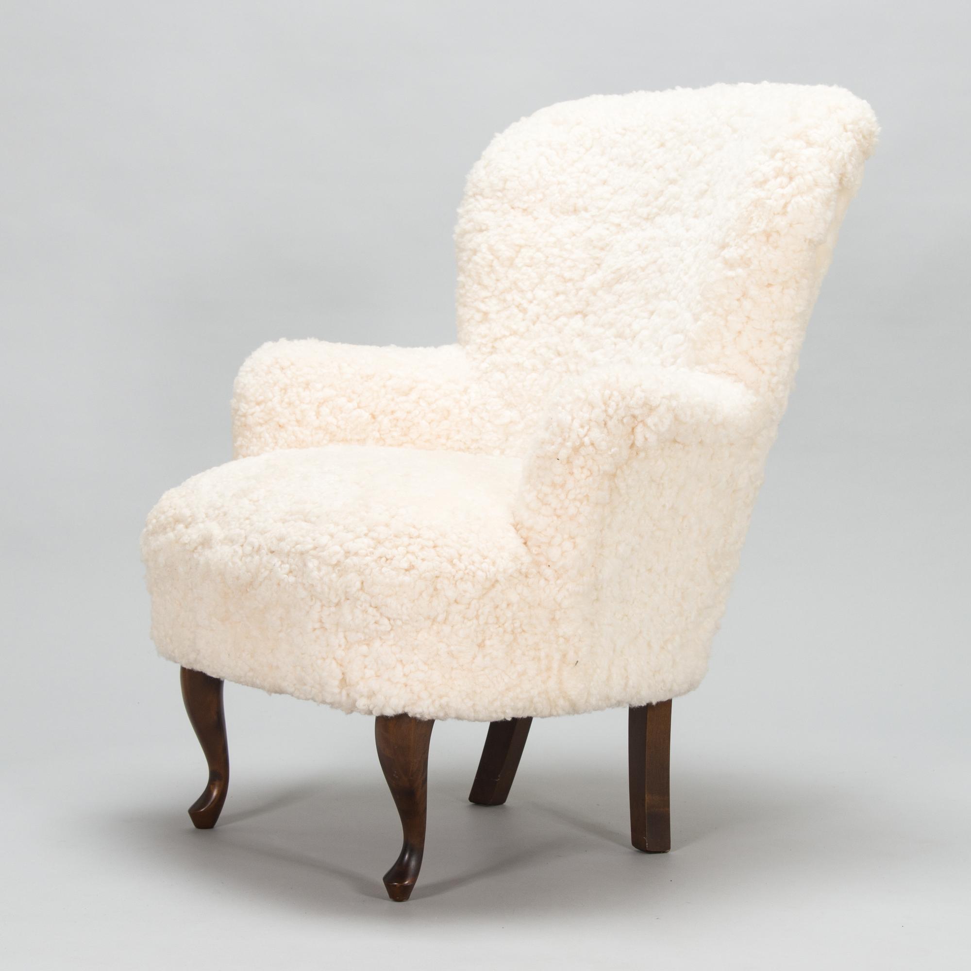 A contemporary sheepskin upholstered lounge chair, ABC collection.