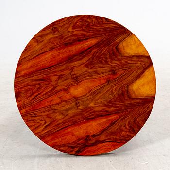 A veneered table from the first half of the 20th century.