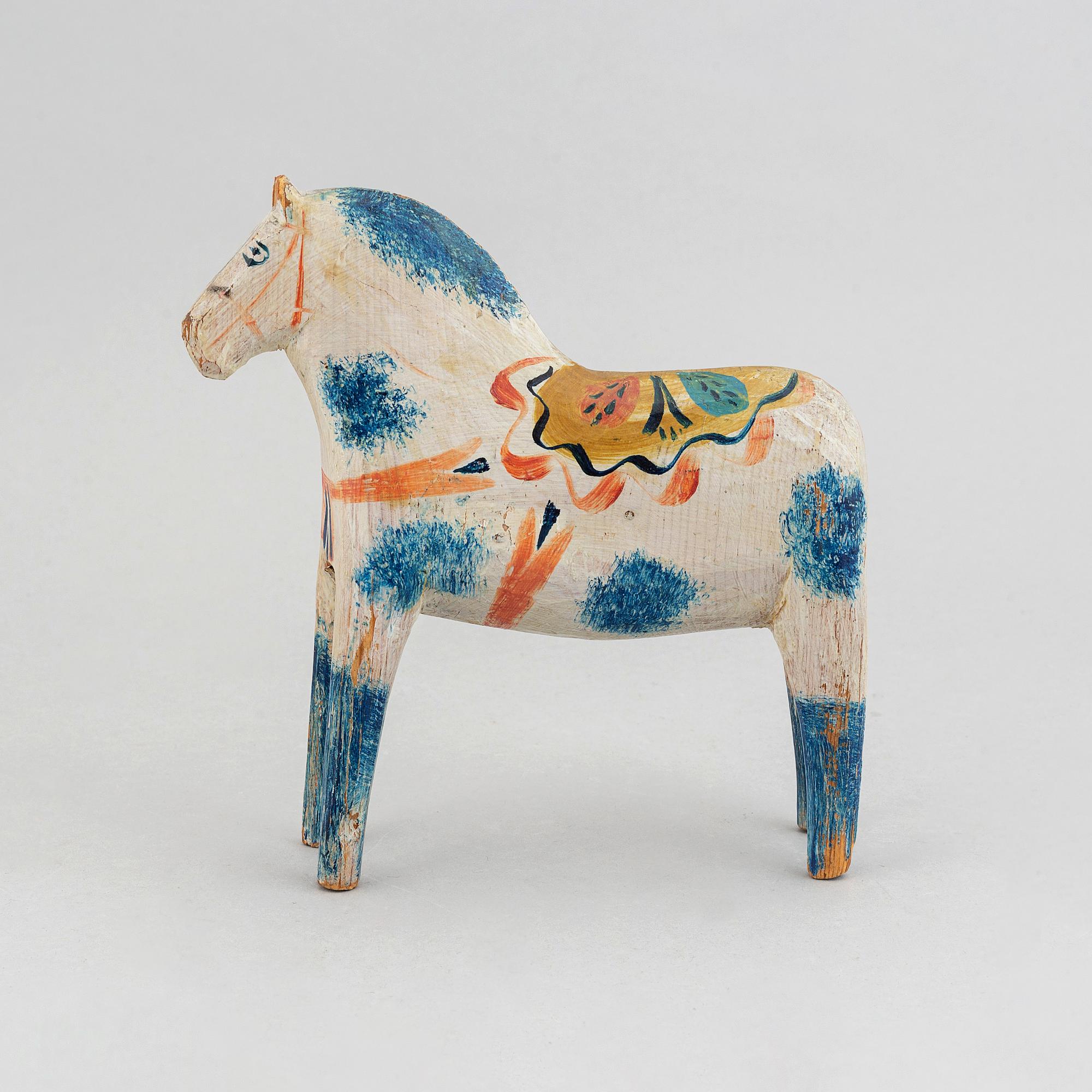 A wooden carved and painted 'Dalahäst', early or mid 20th century.