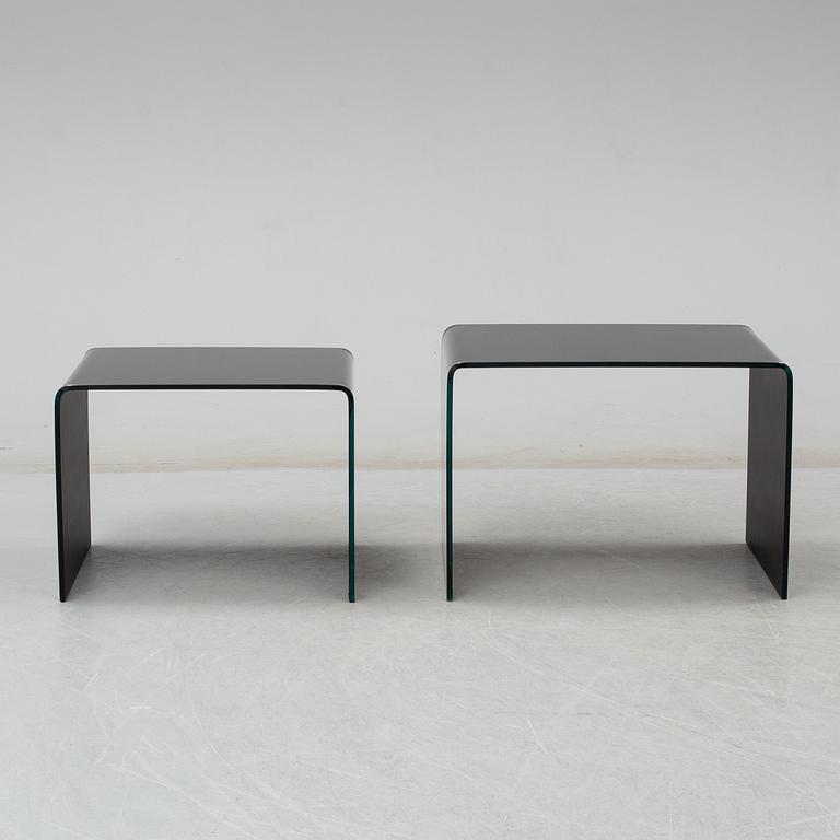 Two modern glass tables.