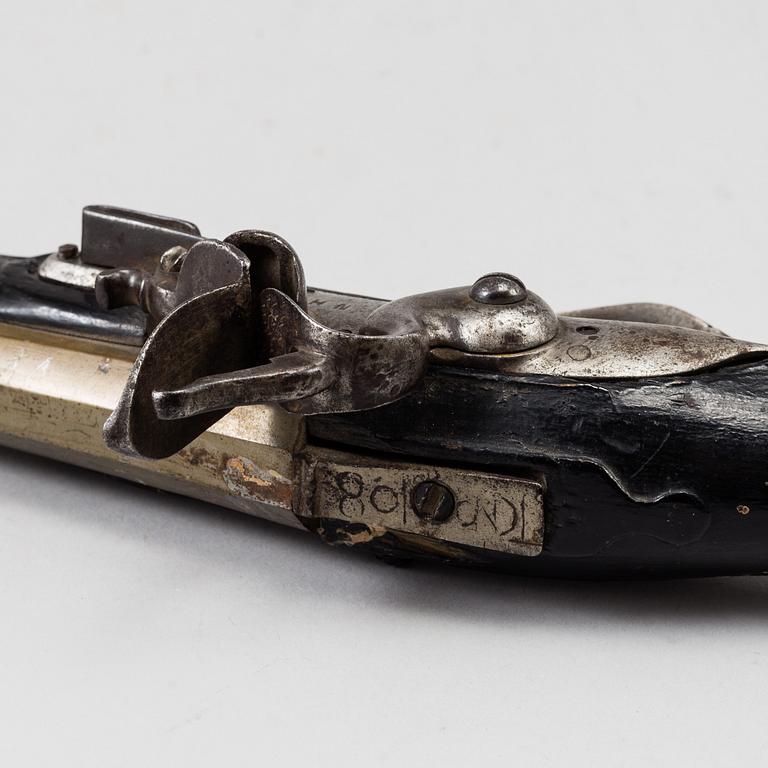 One flint lock postol, late 18th ct, and one percussion pistol, 19th ct.