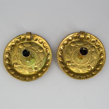 A pair of brass baroque style candlesticks.