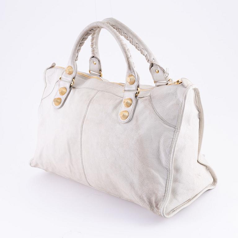 Balenciaga, a white leather 'City' bag.