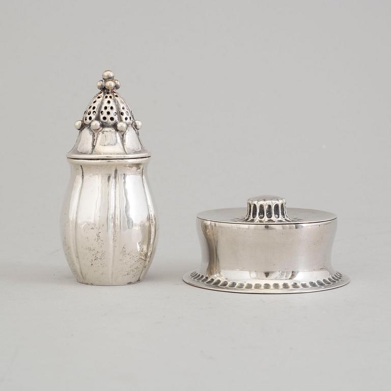 A Swedish Art Nouveau parcel-gilt lidded box and silver pepper shaker, mark's Anders Nilsson, Lund 1913 and 1922.