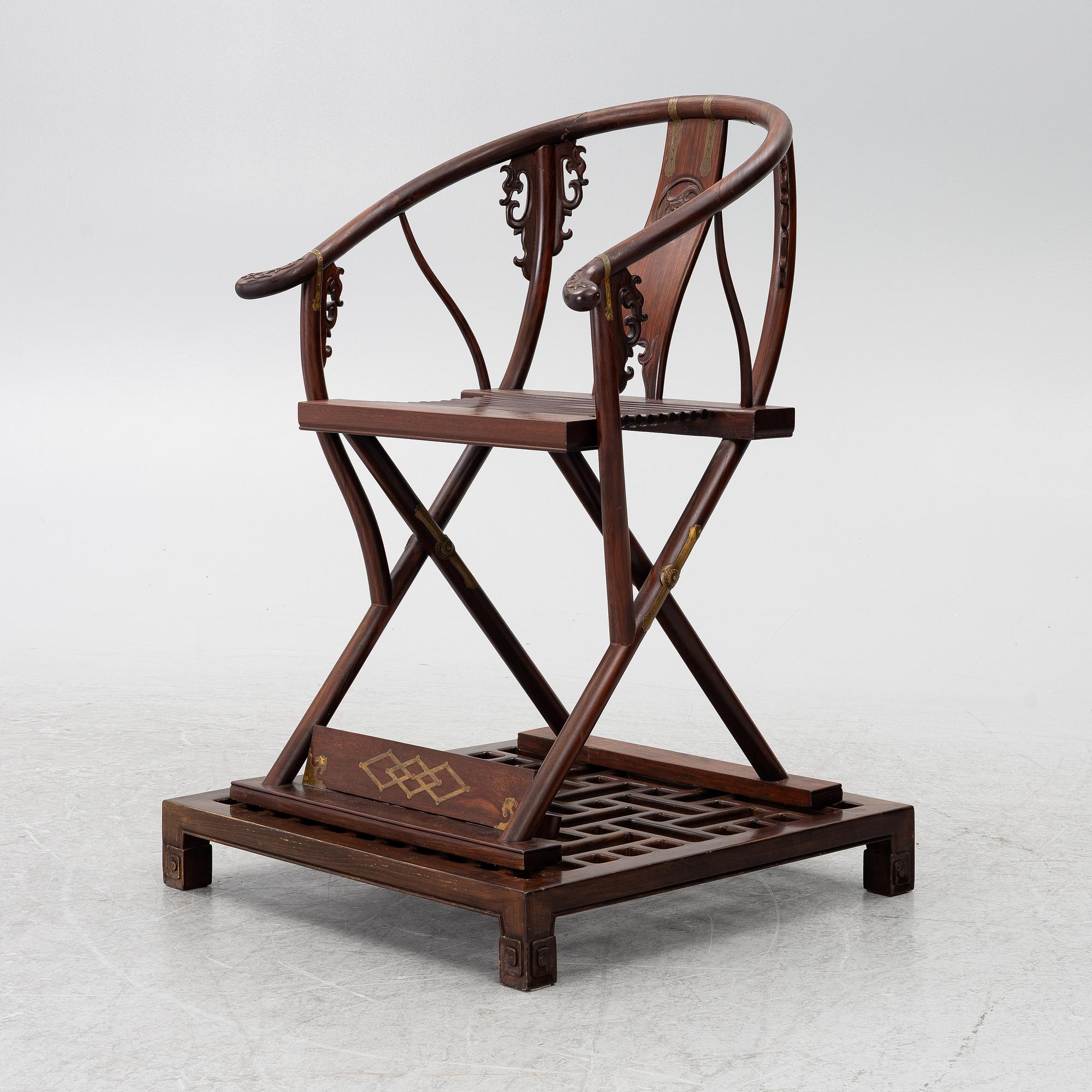 A Chinese hardwood folding chair, 20th century.