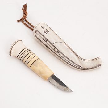 A reindeer horn knife by Tomas Valkeapää, signed and dated 1993.