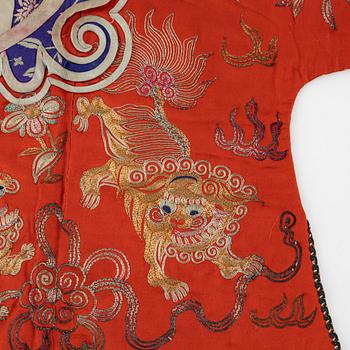 A Chinese embroidered silk jacket for children, late Qing dynasty, around 1900.