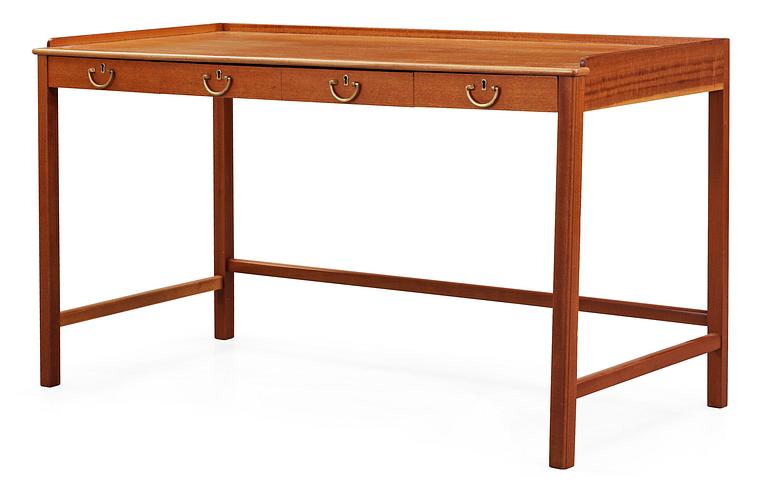 A Josef Frank mahogny desk by Svenskt Tenn.