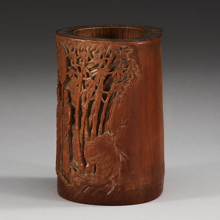 A carved bambu brush pot, late Qing dynasty.