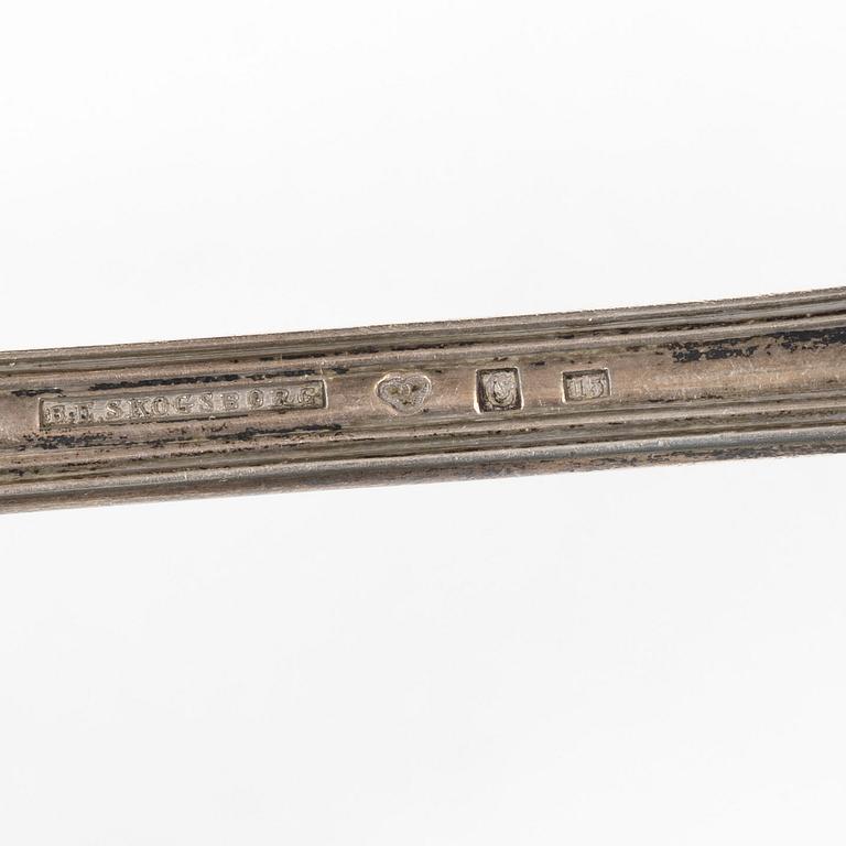 A Swedish silver gilt spoon, and a silver serving spoon, 18-19th Century.