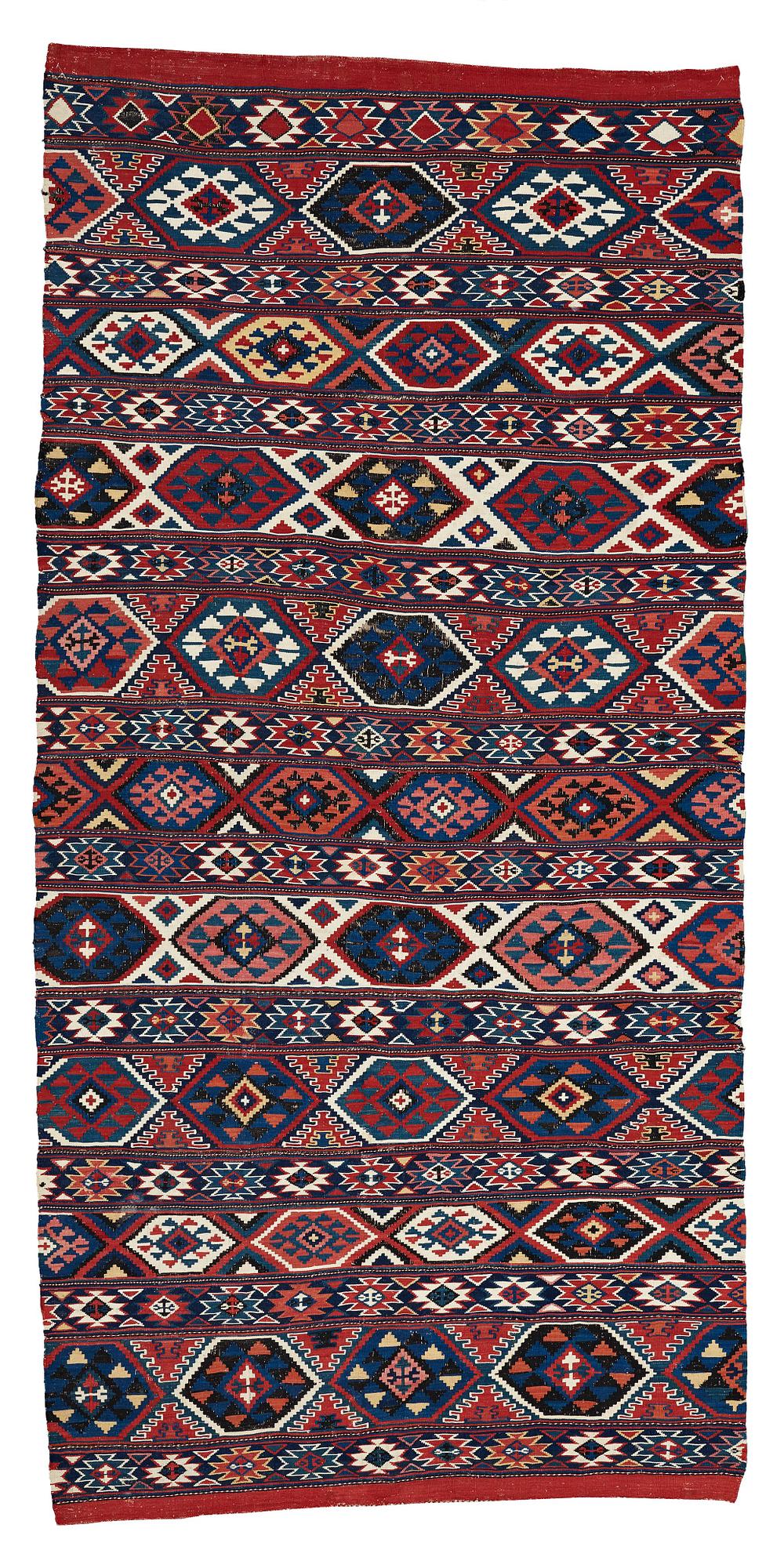 A CARPET, AN ANTIQUE AZERI KILIM, probably a Shirvan, ca 250 x 117,5 cm.