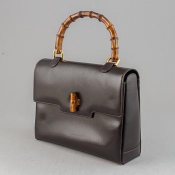 Gucci, a leather and bamboo bag.