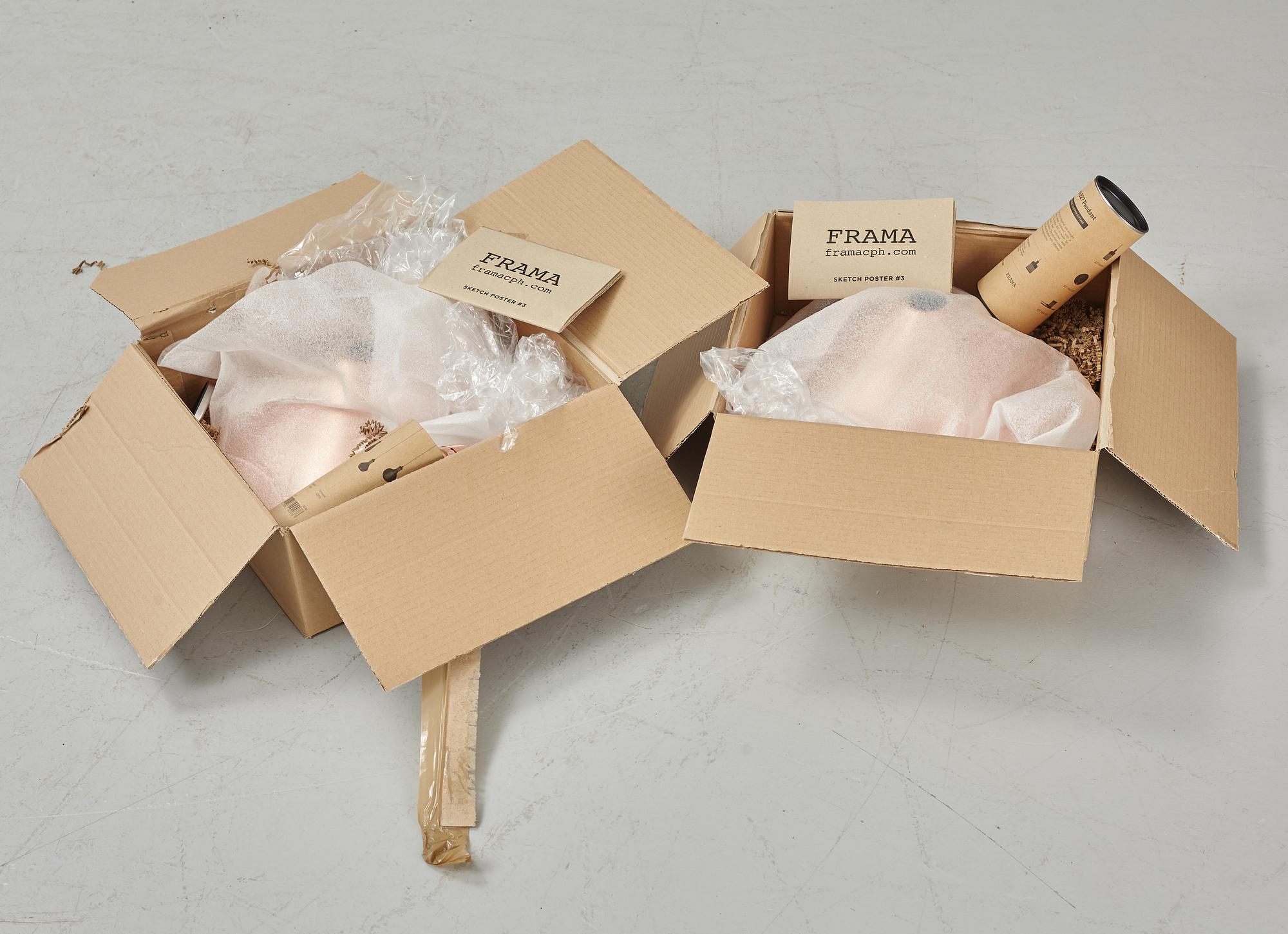 A pair of Frama Shade 360 ceiling lamps.