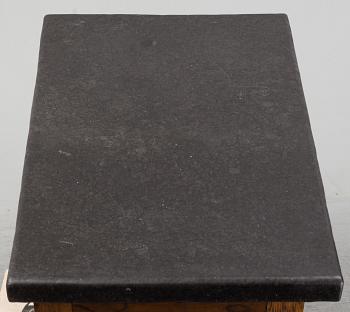 A 19th Century Baroque style table with a stone top.